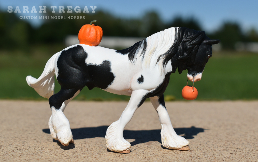 CM Breyer by Sarah Tregay, a Custom Mini/ Stablemate Model Horse to black and white pinto drum horse with purble bow and jack-o-lantern, a Halloween decorator Breyer Stablmate