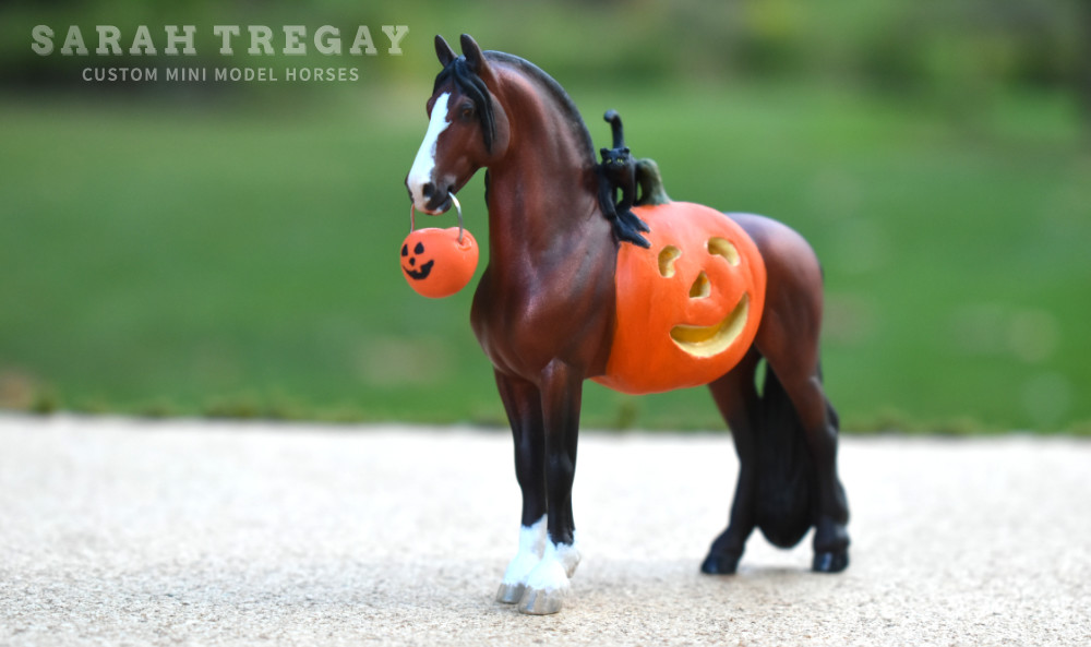 Halloween Model Horse Bay / Clydesdale x Frieisan Stallion, Trick-or-treat, Custom Breyer Stablemate by Sarah Tregay, a Custom Mini/ Stablemate Model Horse with cat and a pumpkin belly Jack-o-lantern