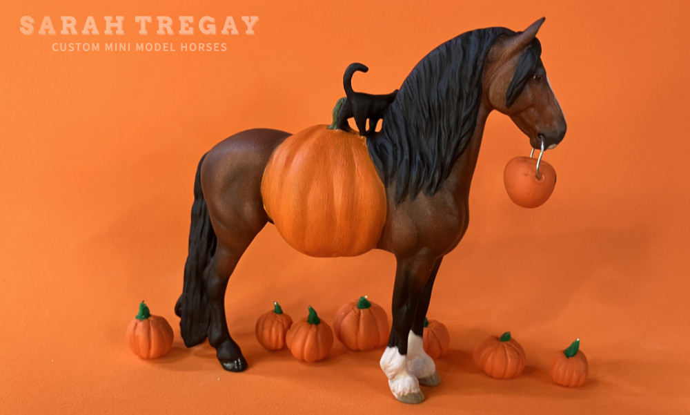 Halloween Model Horse Bay / Clydesdale x Frieisan Stallion, Trick-or-treat, Custom Breyer Stablemate by Sarah Tregay, a Custom Mini/ Stablemate Model Horse with cat and a pumpkin belly Jack-o-lantern