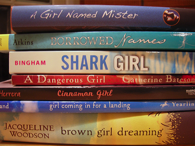 Spine Poem of Novels in Verse: A girl named Mister borrowed names/ Shark Girl / A Dangerous Girl / Cinnamon Girl /Girl Coming in for a Landing / Brown Girl Dreaming (by Sarah Tregay)